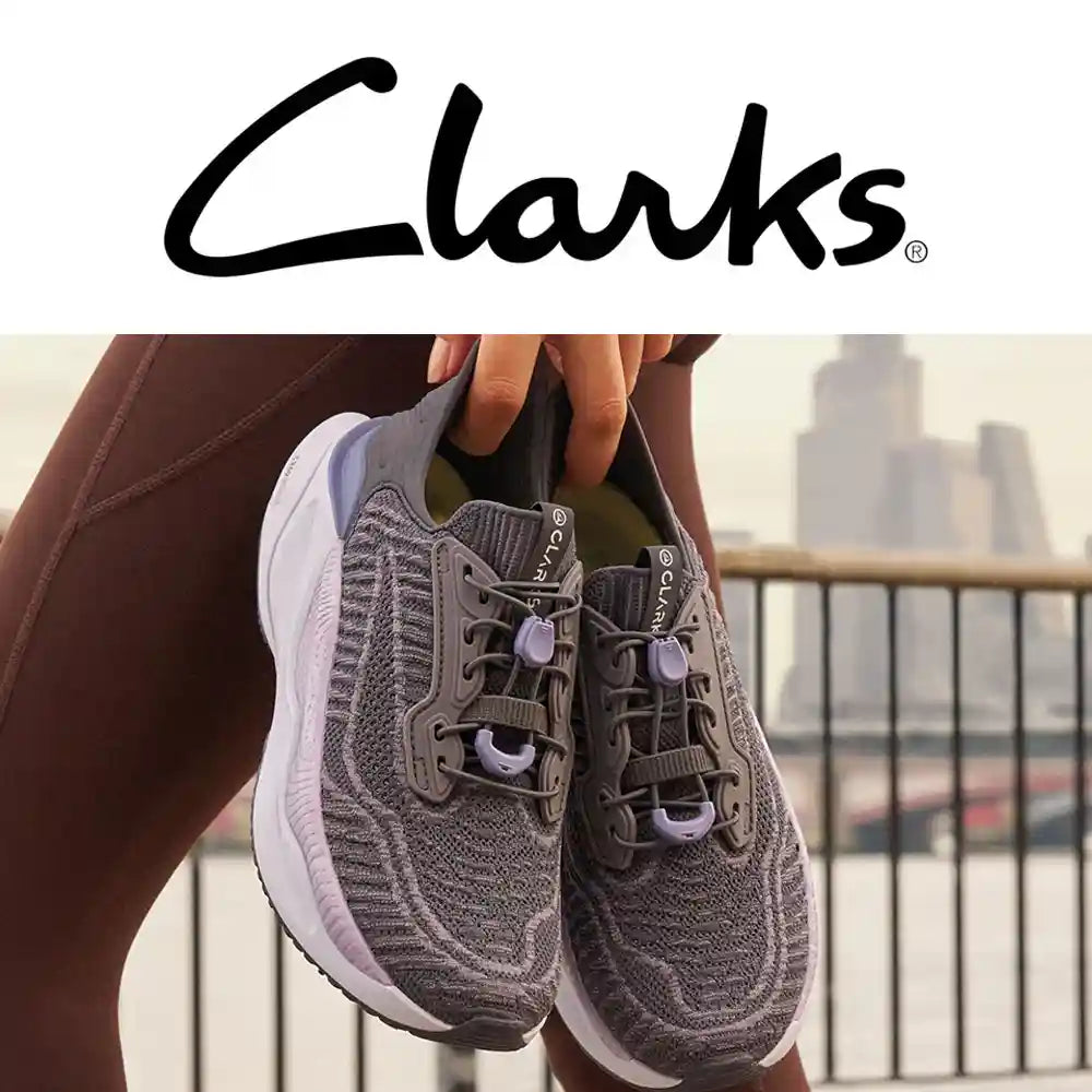 man and smiling toddler with clarks shoes