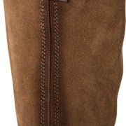 Close-up of brown suede boot with stitching detail on a white background