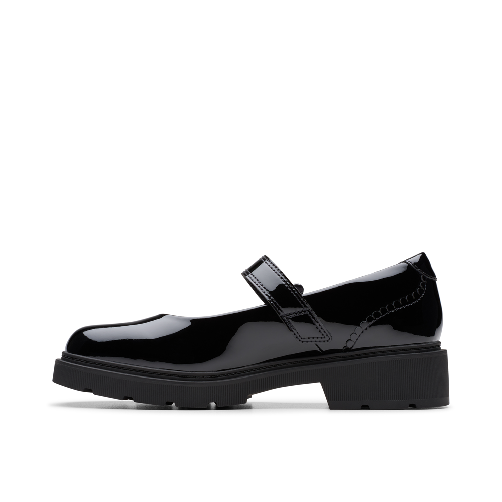 Black patent leather shoe on a white background